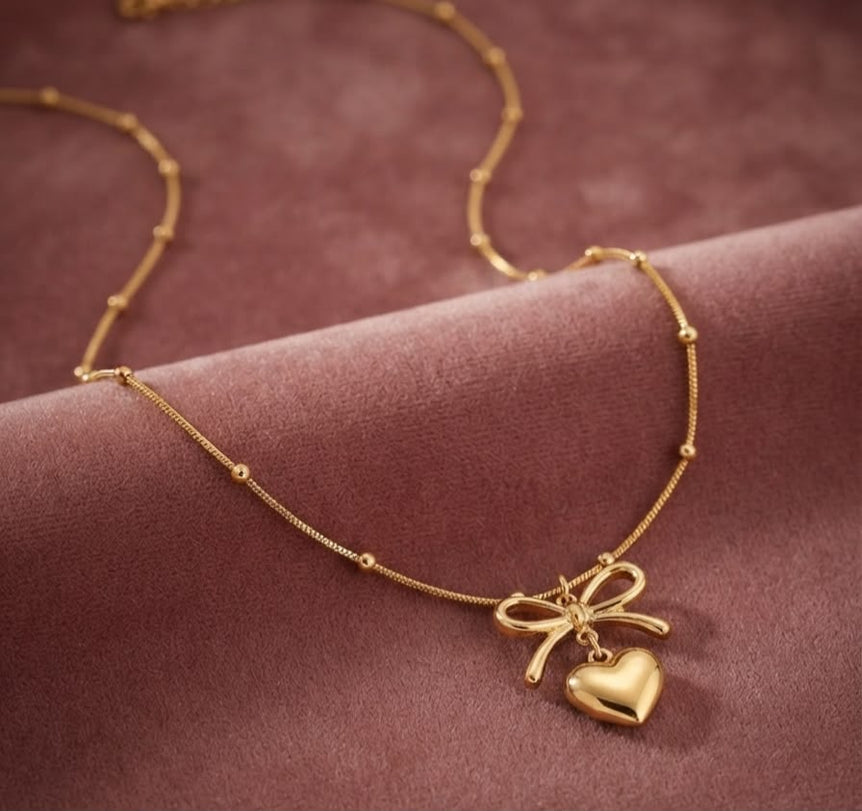 Bow heart locket